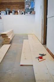 How To Update Concrete Floors For A Rustic Look Diy Flooring Diy Wood Floors Plywood Plank Flooring
