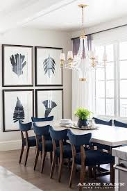 Chic Dining Room Boasts A White Beadboard Ceiling Accented With A Crystal And Brass Chande Mid Century Dining Room Velvet Dining Chairs Dining Room Inspiration