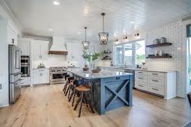 I love the white color paired with the shine from the metal roof. Elements That Make Ranch Style Homes Look As Well As They Work Farmhouse Kitchen Design Rustic Kitchen Kitchen Style