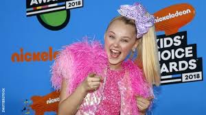 Dancer jojo siwa and jiff pom the dog attend the abby lee dance company la's vip grand opening at abby lee dance company la on may 30, 2015 in santa monica, california. 48ydo Cpk Ihm
