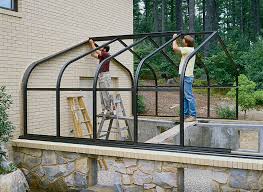 Slide the door pieces together on the ground, then attach the door and hinges onto the greenhouse frame. Constructing A Home Greenhouse Finegardening