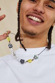 The image below shows a necklace worn at 16 and 18. Dice And Smiley Face Necklace Jaded London