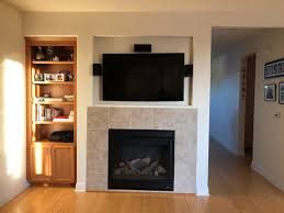 This is as much asthetic at first but generally speaking sound bars are designed with that in my experience (from what i've seen and heard over the years) is definitely below, both for asthetics and for sound. Need Ideas For Fireplace Mantel With Tv Mounted On The Top