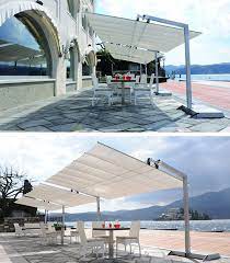 Flexy Is A Large And Modular Freestanding Awning Its Canopy Made In Acrylic Canvas Can Be Tilted To Provide Op Pool Shade Large Patio Umbrellas Outdoor Design