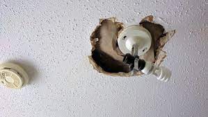 So i got rid of the lamps and took down the hooks, but it left me. Repairing A Hole Around Light Fixture On Stucco Textured Ceiling Doityourself Com Community Forums
