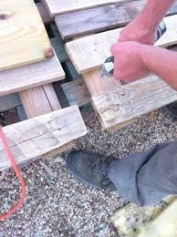 Deck Screws To Hold The Pallets Together The Second Wind Of Texas Featured On Remodelaholic Pallet Decking Pallet Wooden Diy