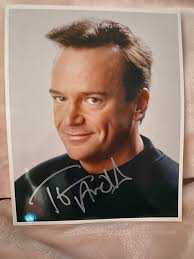 Tom Arnold signed photo