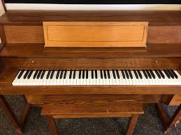 Since the recession, used pianos at all price levels have plummeted in value. Hampton Oak Small Used Console Piano Murray Piano Gallery
