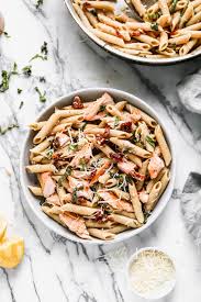 A simple creamy pasta dish made with salmon, frozen peas and cream. Salmon Pasta With Creamy Sun Dried Tomato Sauce Wellplated Com