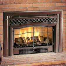 i like how this fireplace has a dark metal grate which looks nice with the brick background someth fireplace inserts wood burning fireplace inserts fireplace