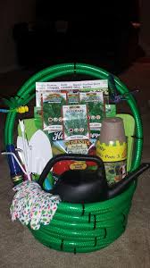 On the last coil of the hose, loop the hose as shown and secure the handle on each side with a zip tie. Water Hose Garden Basket Auction Gift Basket Ideas Themed Gift Baskets Creative Diy Gifts