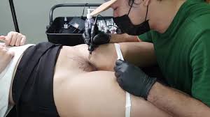 Thai doll got very excited during the tattoo session, allowing the master  to fuck her pussy.