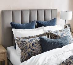 Headboard has multiple attachment points to accommodate frames of various heights. Kira Channel Tufted Upholstered Headboard Pottery Barn