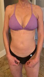 Slutty granny Demi strips naked - Plays with her pussy at poolside