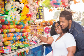 Sometimes all it takes to keep your toddler busy is a balloon. Real Couple Fun Filled Carnival Love Session In Durham Nc Brittany Deon Catalyst Wedding Co