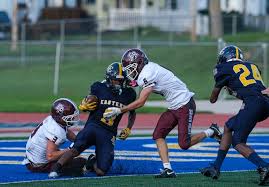 MHSAA football scores 2026 Week 9 live high school football game under Friday night stadium lights in Michigan