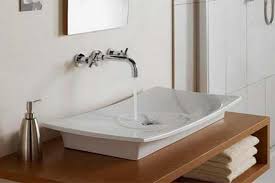 The rustic bathroom is inviting and warm. Modern Bathroom Sink Designs