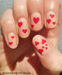 Hot pink nail design with glitter and small hearts. Heart Nail Art Wonderfulwolf