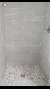 To avoid creating a look that falls flat, layer various shades of the same hue throughout the room through the flooring, vanity, shower curtain, and accent pieces. Small Bathroom Neutral Bathroom Tiles Novocom Top