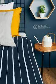 These are the best paint colors to paint your bathroom to help you create the perfect retreat at the end of a long work day. Updating Your Guest Bedroom With Modern Colors Navy With Pops Of Yellow Day Spa 0634 Modern Colors Paint Trends Interior Paint Colors