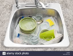 dishes soaking in the kitchen sink