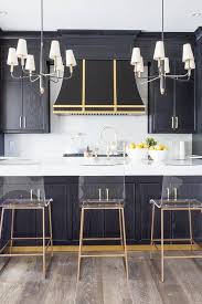 black kitchen island with gold trim and