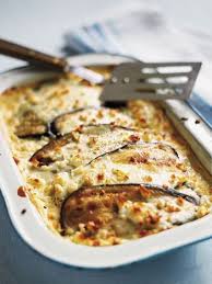 The Quintessential Summer Food This Recipe For Stuffed Tomatoes With Rice And Ground Beef Is Ideal For Summer Entertaining M Moussaka Recipe Moussaka Recipes