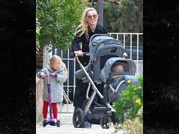 Amber Heard All Smiles as Johnny Depp Films Hollywood Return