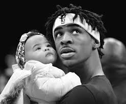 Woman charged after man falls from car