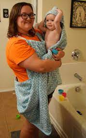 This will help you so that you only have to cut once, and it will stay symmetrical. Make A Baby Bath Towel Apron The Tiptoe Fairy