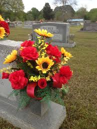 It all went in a dumpster. Cemetery Vase Using Red Roses Yellow Sunflowers Yellow Forsythia With Red Ribbon Streamers April Memorial Flowers Cemetery Flowers Flower Vase Arrangements