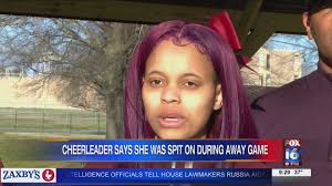 Cheerleader says she was spit
