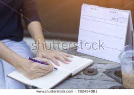 Woman Hands Writing Plan On Notebook Planning Agenda And Schedule Using Calendar Event Planner Calendar P Writing Plan Organized Calendar Planner How To Plan