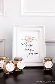 I am sure that you could use real flowers, but by using fake ones as they do here you ensure that the balloon will last longer, and the expectant mother can even take it home to keep as a memoir of the day. Diy Popcorn Baby Shower Favors Domestically Blissful