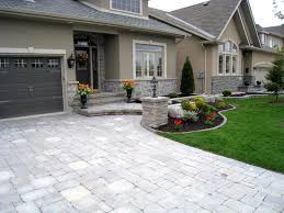 For a quick win, spread a thick layer of barkdust or mulch over your front yard garden beds. Best Driveway Surfaces For Canada Driveway Design Driveway Landscaping Front Garden