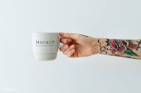 Download Premium Psd Of Tattooed Hand Holding A White Coffee Cup Mockup White Coffee Cups Pink Coffee Cups White Coffee