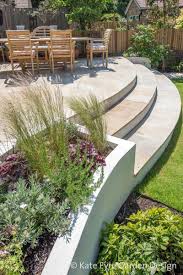 A garden design that makes a feature from a constraint. Medium Sized Back Garden Design In Wandsworth 2 Garden Design Layout Patio Garden Design Garden Design Plans