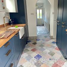 Many choices are available depending on how much you want to spend on it. Spanish Tiles And Bright Blue Cabinets