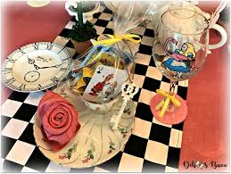 Our daughter wanted an alice in wonderland party so here are the decorations we made. Alice In Wonderland Table And Party Favors Debbee S Buzz