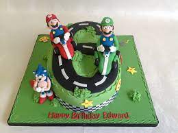 Cheapest boy's birthday cakes online. Number 6 Shaped Mario Themed 6th Birthday Cake With Handmade Character Models 6th Birthday Cakes Mario Cake Super Mario Cakes