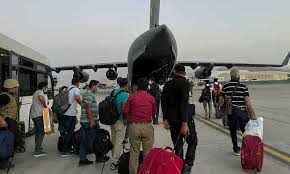Security forces assist people struggling to flee the country outside the abbey gate at. Greater Stability As Western Forces Help To Secure Kabul Airport Afghanistan The Guardian