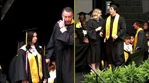 Twin brother accepts Austin Metcalf's posthumous diploma at Frisco graduation