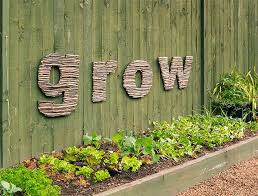 How To Make Stick Letter Outdoor Art Add Character To Your Garden With This Quirky Earthy Outdoor Artwork Diy Funny Garden Signs Garden Signs Sensory Garden