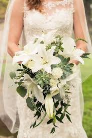 Say, here's lookin' at you, kid, with this light and bright bouq. White Lilies And Succulents Google Search Lily Bridal Bouquet Lily Bouquet Wedding Bridal Bouquet Flowers