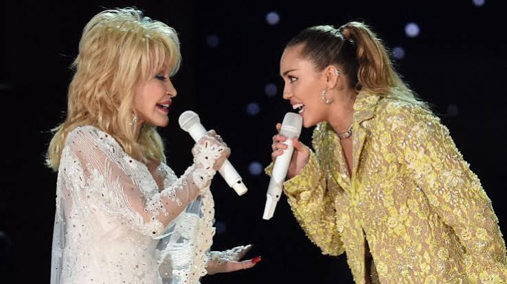 Miley Cyrus remembers godmother Dolly Parton as an 'angel by my side' - BBC News