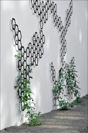 I Love This Garden Trellis It Is Interesting Fun And Looks Like Garden Sculpture Rather Than Hardware Decorative Trellis Metal Trellis Indoor Vines