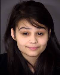 Woman charged in fatal October crash