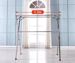 Folds in half for easy storage. Standing Clothes Laundry Drying Rack Coat Hanger Organizer Adjustable Metal Corner Tension Pole Grey Buy Standing Clothes Laundry Drying Rack Adjustable Meta Cloth Drying Stand Product On Alibaba Com