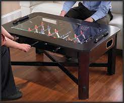 The urge to attain indoor gaming equipment though stereotypical can be felt by husbands and fathers from all around the world. Foosball Coffee Table Coffee Table Coffee Table Design Furniture Design Modern