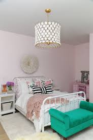 We are slowly but surely getting our small apartment set up. Cc And Mike Frisco I Project Reveal Ballet Pink Girls Bedroom Design With Jenny Lind Bed And Juju Hat Hanging Above The Bed Black And White Striped Bow Pillow Cc